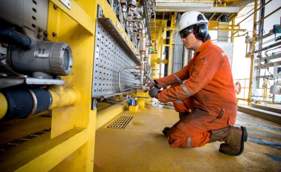 Skilled gas fitter repairing leaks and pipeline issues.