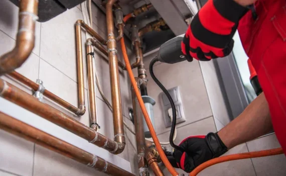 Skilled plumber fixing leaks, pipes, and heating systems.