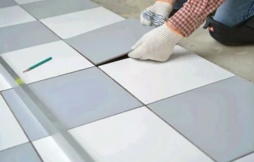 Skilled technician providing clean and durable tile finishing.
